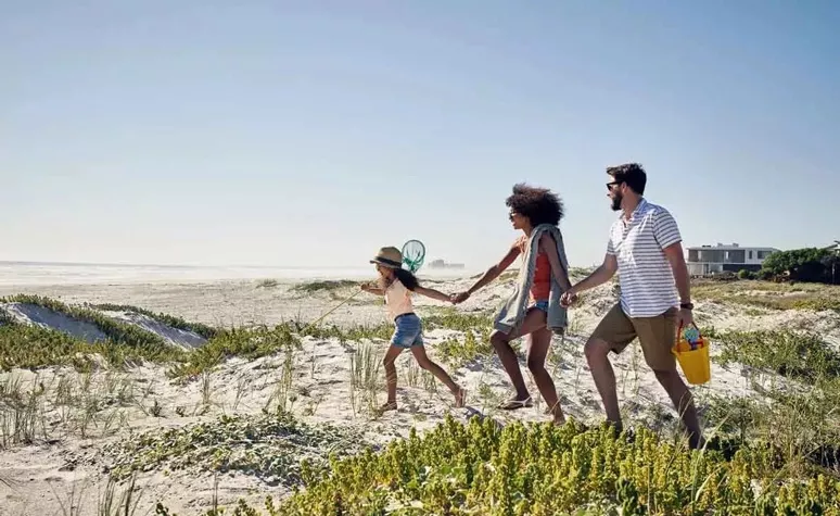  Family walking on the beach
