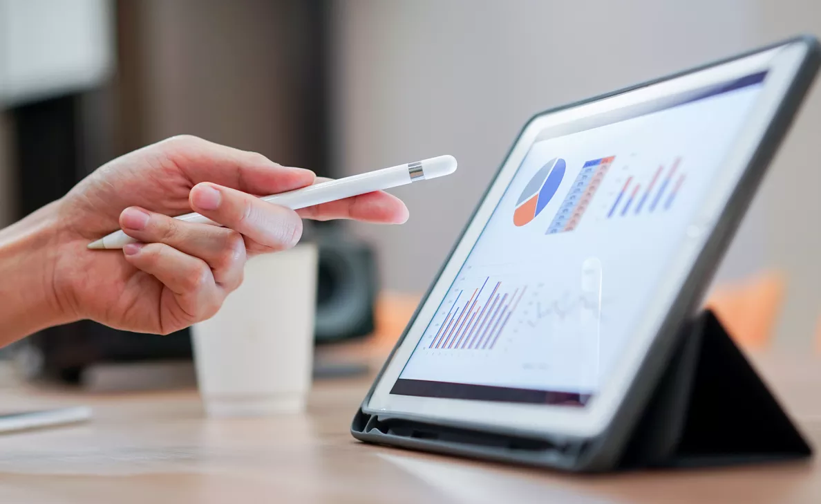  A tablet displaying financial charts and graphs.
