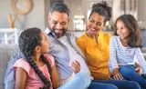 A family enjoying quality time together in the living room.