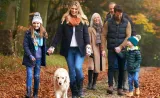 Family walking with their dog